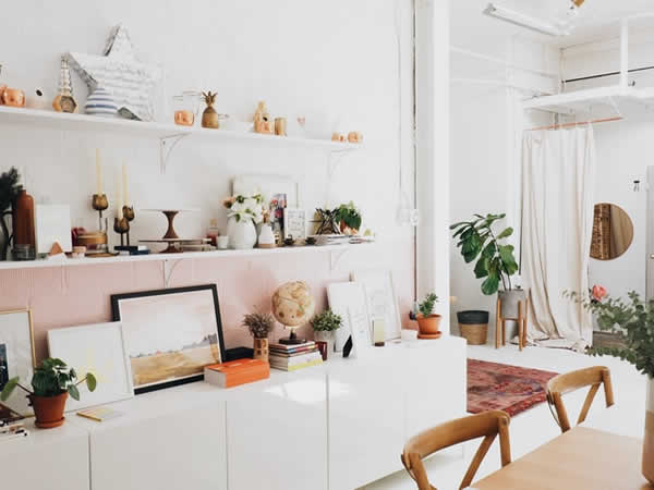 dining room wall with shelves with assorted items